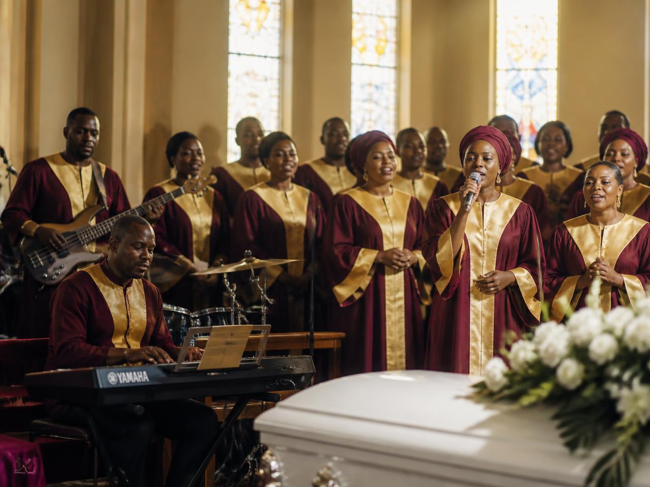 Gospel choir and musicians performing at a funeral service